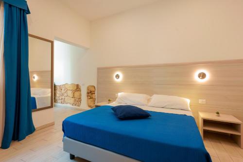 Ένα ή περισσότερα κρεβάτια σε δωμάτιο στο Bardilio Luxury Rooms