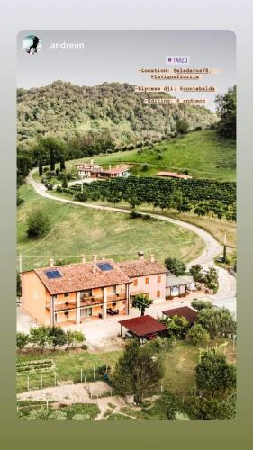 an aerial view of a building in a field at LA VIGNA FIORITA B&b in Tarzo