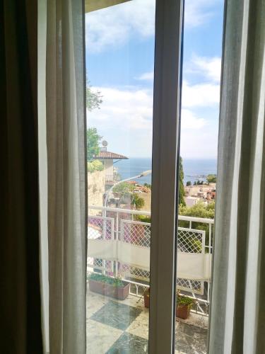 a view of the ocean from a hotel room window at Villa Giannina B&B in Taormina