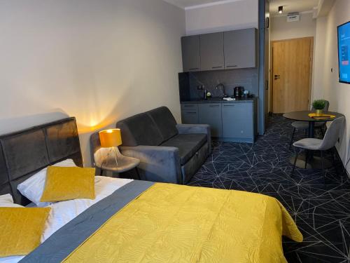 Katil atau katil-katil dalam bilik di Aparthotel Przy Plaży