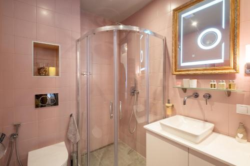 a bathroom with a shower and a sink at Premium Apartments - Top-Notch Place 2BR/2BTH in Sofia