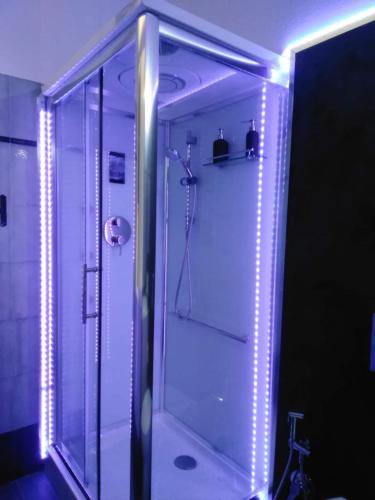 a bathroom with a shower with lights in it at Palazzo Iargia in Canicattini Bagni