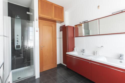 a bathroom with two sinks and a shower at B&B Il giardino degli incanti in SantʼElpidio a Mare