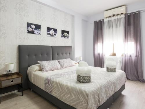 Posteľ alebo postele v izbe v ubytovaní Click&Flat Xoriguer
