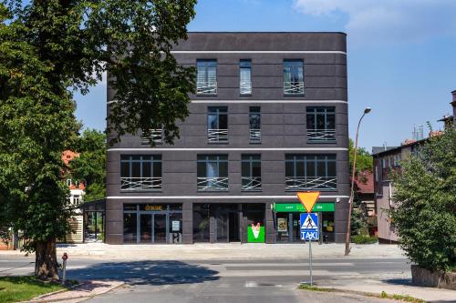 a building on a street in front of a building at Luxo apartments 13 in Jelenia Góra