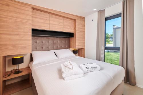 Postel nebo postele na pokoji v ubytování San Servolo Wellness Homes