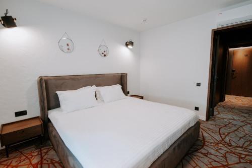 Ένα ή περισσότερα κρεβάτια σε δωμάτιο στο Hotel Selena Family Resort