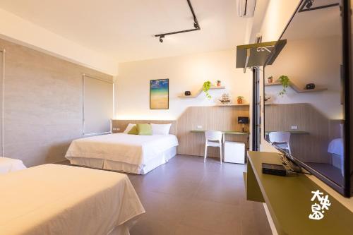 Katil atau katil-katil dalam bilik di 大央島海景休閒民宿