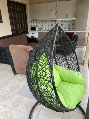 a hammock hanging in a living room at Guest House Giorgi in Makhinjauri