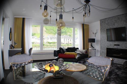 a living room with a table with fruit on it at Moselapart in Cochem
