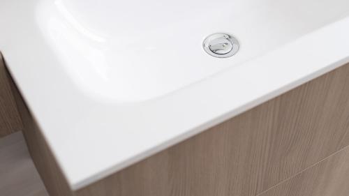 a bathroom sink with a drain in the wall at Italianway - Villa Tola in Valdisotto