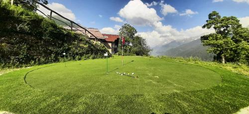 a large green field with golf balls on it at Chalet Cormignano in Vezza dʼOglio