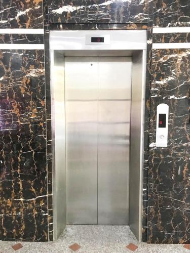a stainless steel elevator door in a building at La Cactus Hotel 2 in Quy Nhon