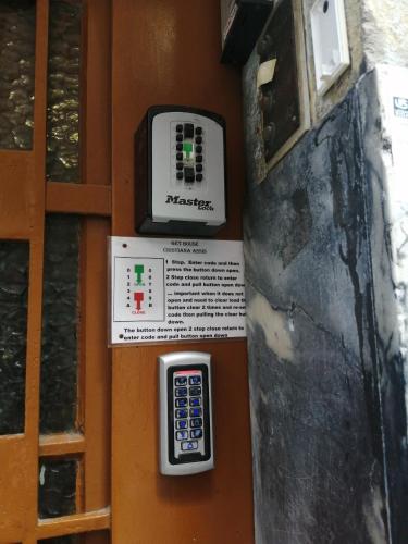 a remote control on the side of a door at AL- Almada 4 in Porto