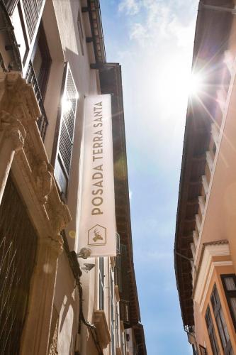 a sign for a hotel on the side of a building at Boutique Hotel Posada Terra Santa in Palma de Mallorca