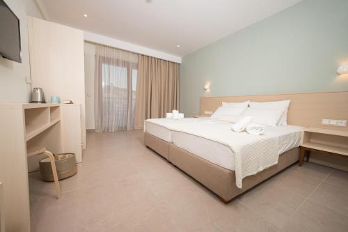 Un pat sau paturi într-o cameră la Samari Afitos