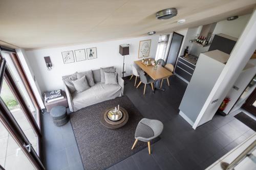 an overhead view of a living room and a kitchen at Vakantiehuis Olivia in Schoorl