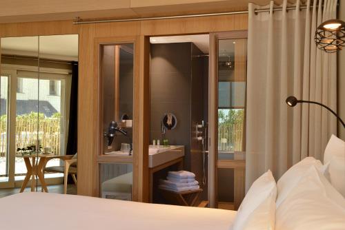 Katil atau katil-katil dalam bilik di Hotel Les Vikings