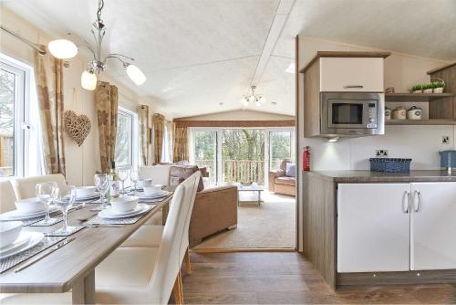 a kitchen and dining room with a table and chairs at Host & Stay - Yolo Lodge in Felton