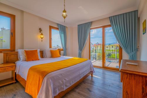 En eller flere senge i et værelse på Infinity Myra Villa