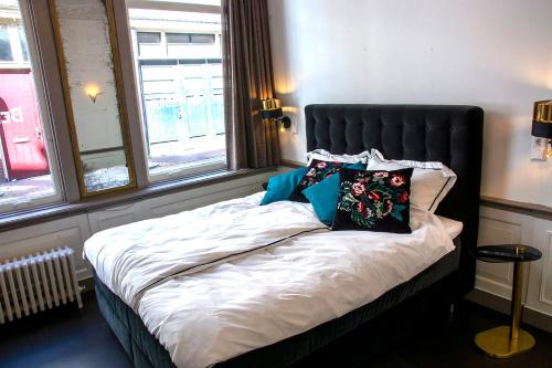 Postelja oz. postelje v sobi nastanitve B&B Belle Chambre - Luxe in Art Deco stijl