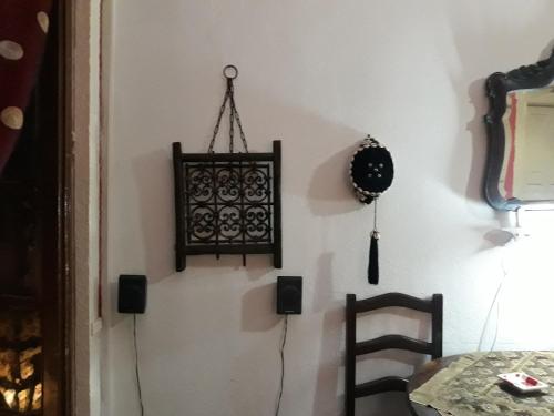 a room with a table and a chandelier on the wall at AL-Almada-2 in Porto