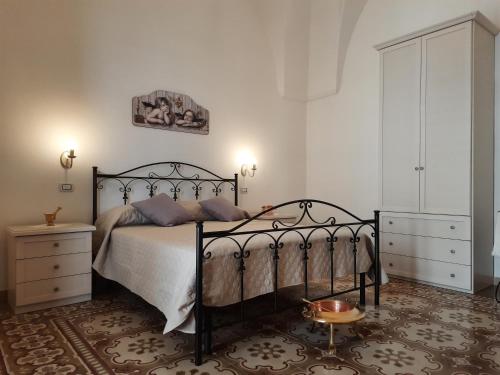 Postel nebo postele na pokoji v ubytování Casa Vacanze Lu Cumentu