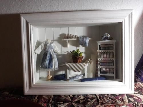 a picture of a doll house in a mirror at AL-Almada-2 in Porto