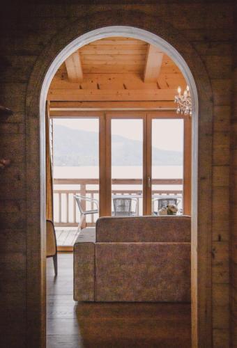 an archway leading into a living room with a couch at Clubhaus Bachmair Weissach in Tegernsee
