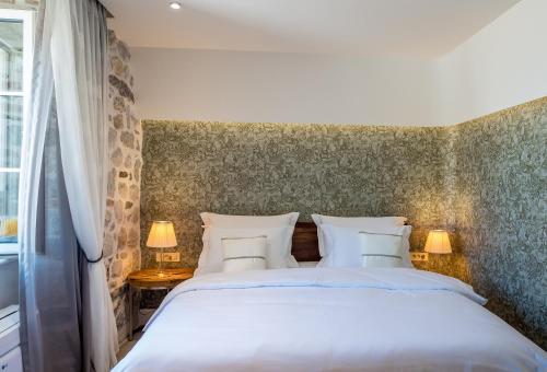 Ένα ή περισσότερα κρεβάτια σε δωμάτιο στο Apartments Hun