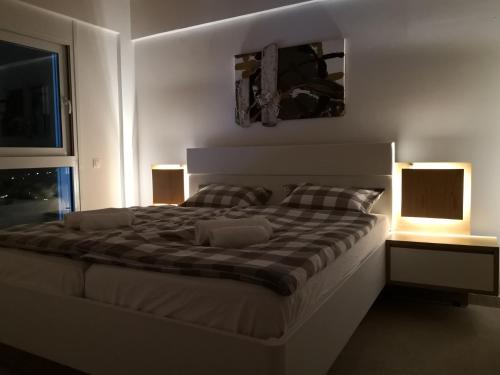 Ένα ή περισσότερα κρεβάτια σε δωμάτιο στο Sunset Sea View Villa 5