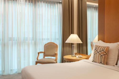 Tempat tidur dalam kamar di Melia Athens