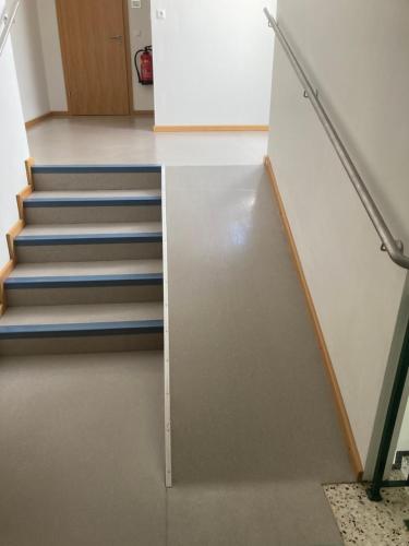a staircase in a room with a stair case at Frühstückspension Josefinum in Bad Aussee
