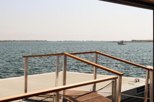 a deck of a boat on a body of water at Les Ilots de Gruissan in Gruissan