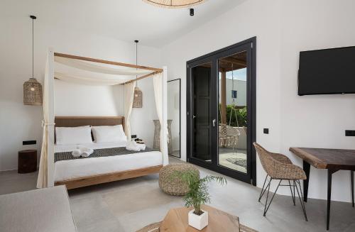Ένα ή περισσότερα κρεβάτια σε δωμάτιο στο Athina Milos Suites