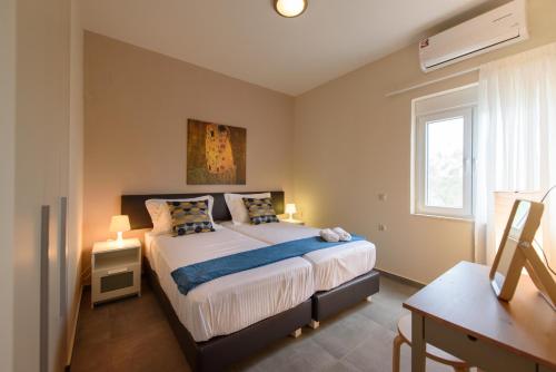 Voodi või voodid majutusasutuse Thetis Beach Suites toas