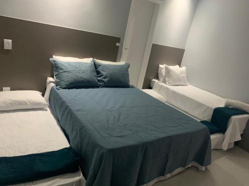 Katil atau katil-katil dalam bilik di Flats Catamarã