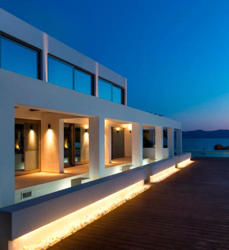 a building with lights on the side of it at LeBlanc Luxurious Beachfront Villa by Goutos Luxury Living in Ermioni