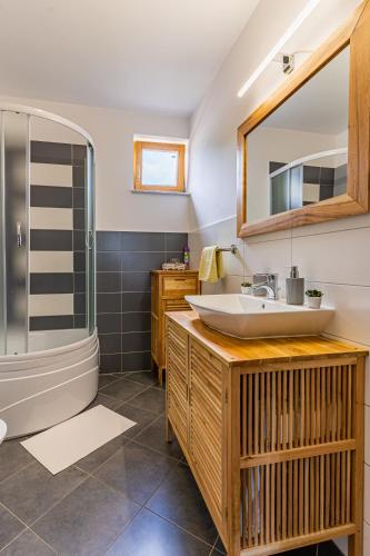a bathroom with a sink and a shower at Apartment Livia in Cres