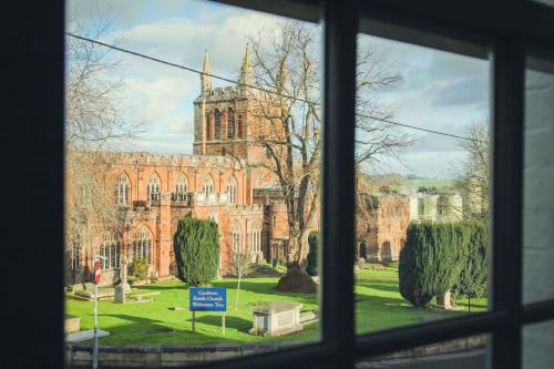 a view of a church from a window at Union Road Moto Velo Accommodation in Crediton