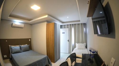 Katil atau katil-katil dalam bilik di Flats Catamarã