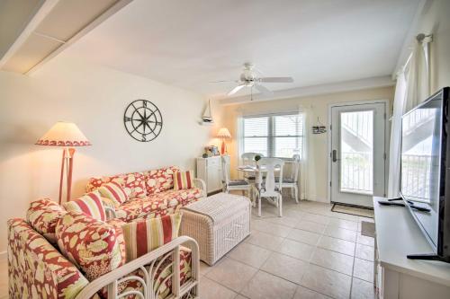 a living room with a couch and a tv and a table at Walk to Wildwood Beach Oceanfront Condo with View in Wildwood Crest