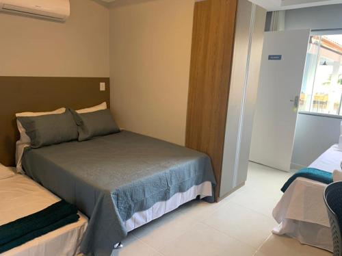 Katil atau katil-katil dalam bilik di Flats Catamarã