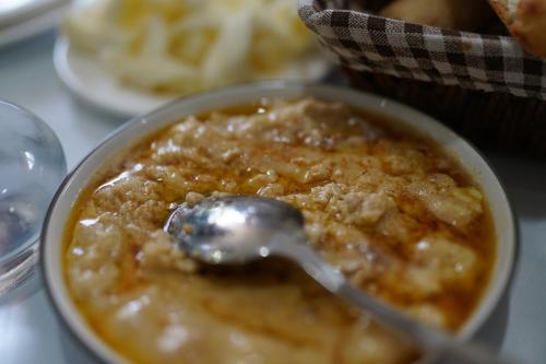 a bowl of food with a spoon in it at Khikhani Palace in Khulo
