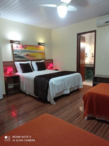 Katil atau katil-katil dalam bilik di Pousada Presidente Hotel