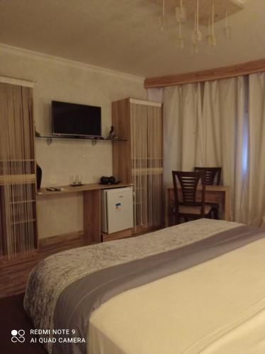 Katil atau katil-katil dalam bilik di Pousada Presidente Hotel