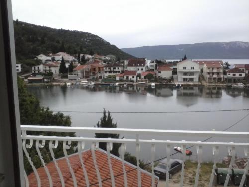 a view of a harbor from a balcony at Apartments Laura in Blace