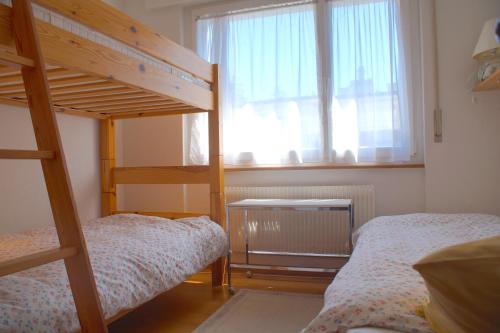 Tempat tidur susun dalam kamar di Central for up to 7 guests, Flaminia