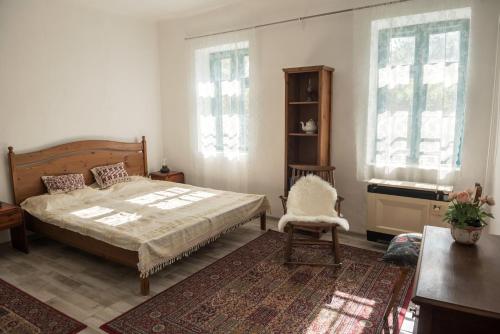 Postel nebo postele na pokoji v ubytování Vánkos Vendégház