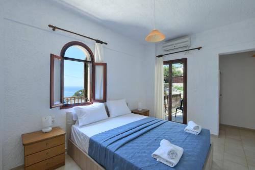 Ένα ή περισσότερα κρεβάτια σε δωμάτιο στο Galini Apartments